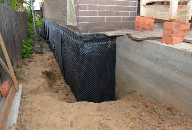 Happy homeowners after waterproofing job in Waupaca